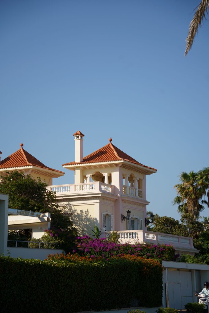 Stunning villa in Sitges, Spain featuring Mediterranean architecture and a vibrant garden.